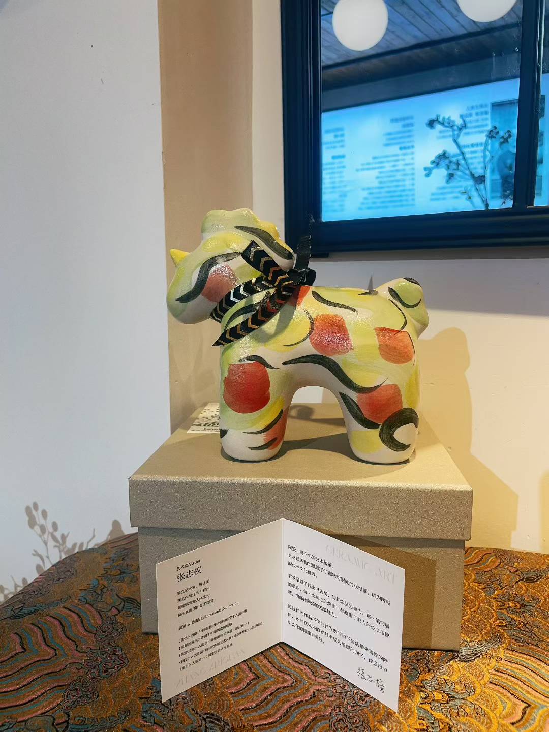 Porcelain Unicorn-Apple Green figurine with red and green patterns on display box