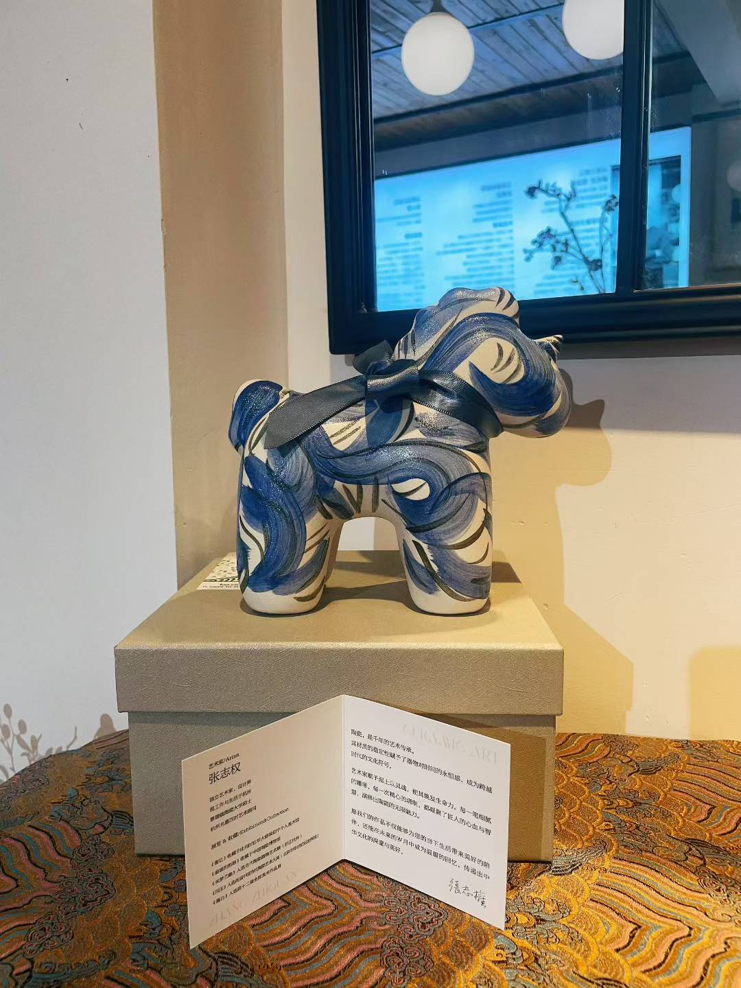 Porcelain Unicorn-Indigo figurine with indigo swirl design, 19x10x17cm displayed on box