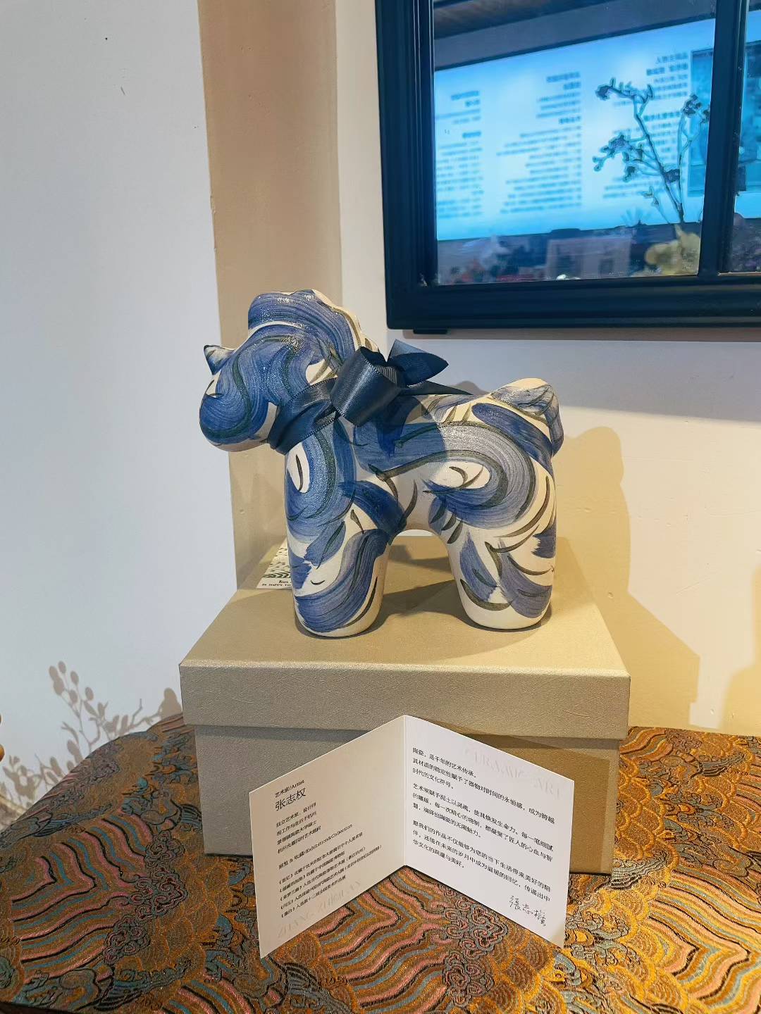 Porcelain Unicorn-Indigo figurine with indigo swirl design on a box