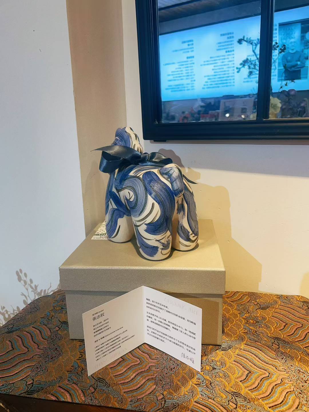 Porcelain Unicorn-Indigo sculpture 19x10x17cm on box indoors